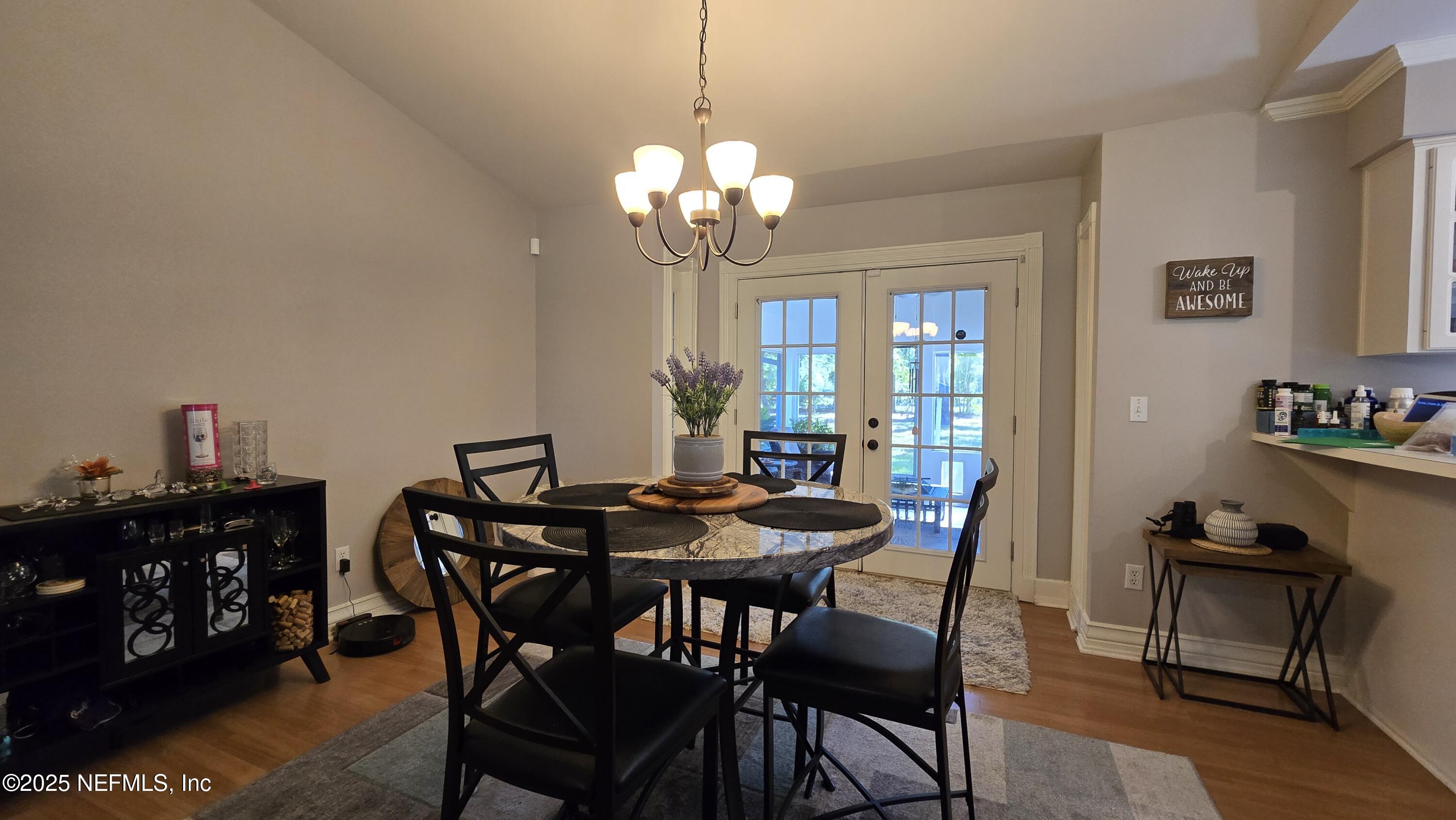 12984 92nd Street Live Oak, FL 32060 - Photo 11 of 32 a view of a dining room with furniture and chandelier