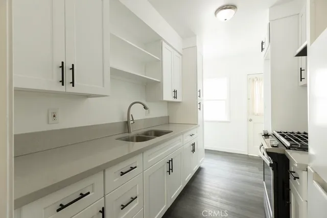 a kitchen with a sink and cabinets
