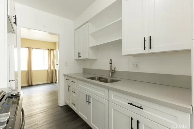 a kitchen with a sink and cabinets