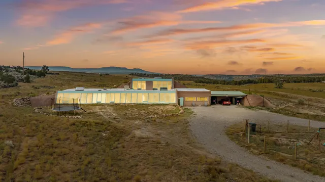 a view of a lake with houses in the back