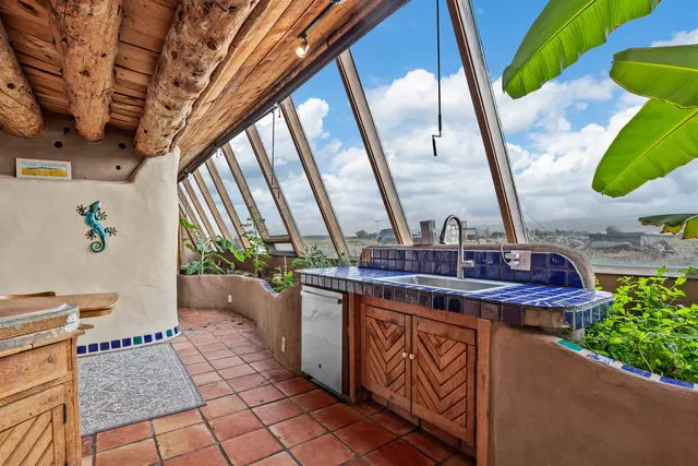 a view of living room with furniture and a floor to ceiling window
