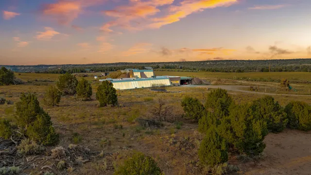 a view of a lake with houses in front of it