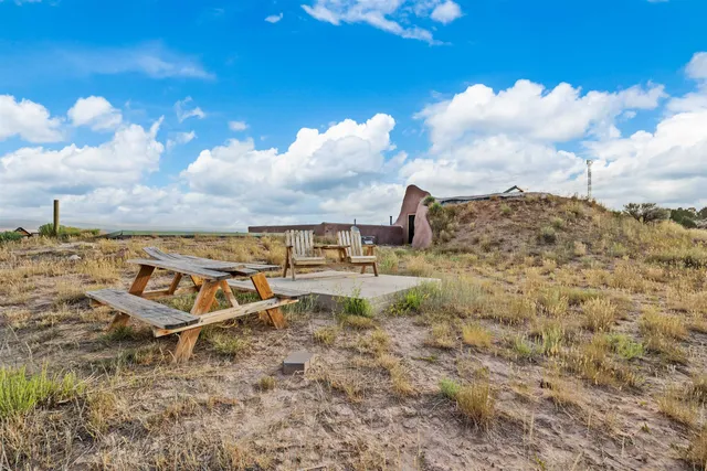 a view of a lake with houses in the back