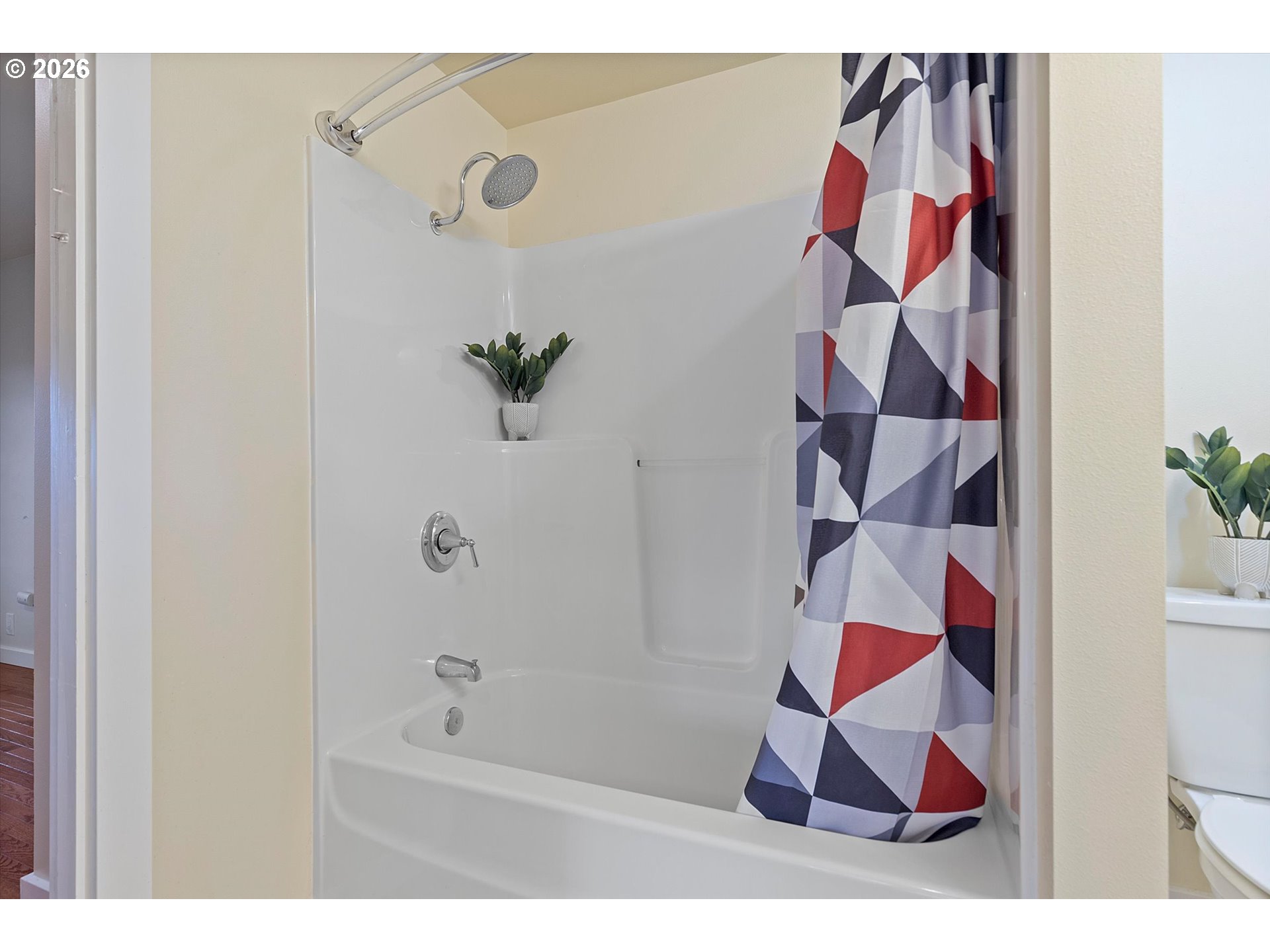 5093 Northeast 49th Street Neotsu, OR 97364 - Photo 15 of 36 a bathroom with a bathtub and a shower curtain