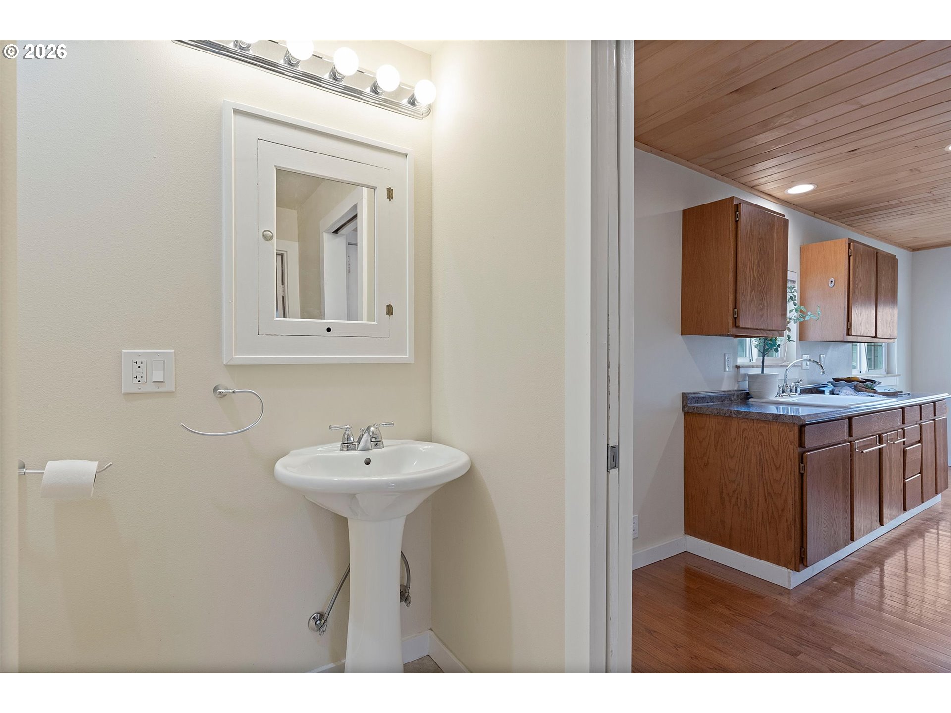 5093 Northeast 49th Street Neotsu, OR 97364 - Photo 16 of 36 a bathroom with a sink and a mirror