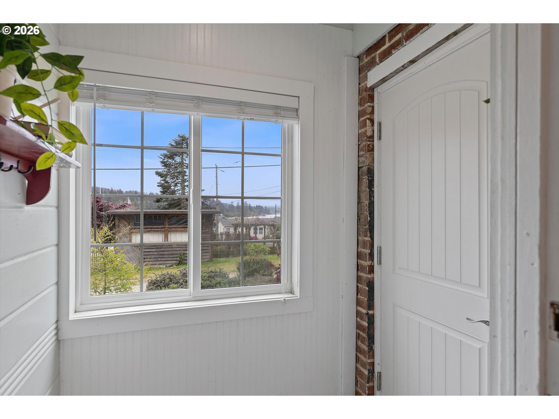 5093 Northeast 49th Street Neotsu, OR 97364 - Photo 26 of 36 a view of a window and a backyard