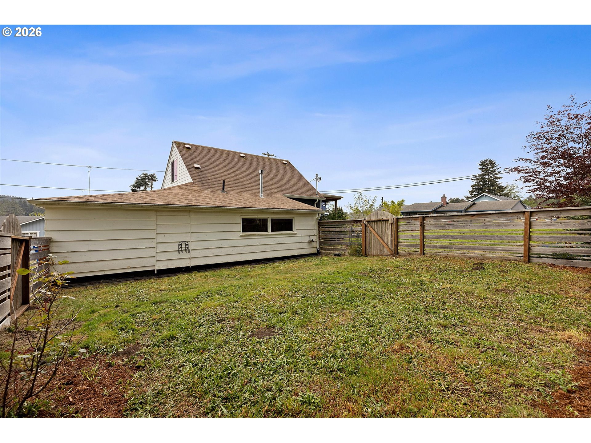 5093 Northeast 49th Street Neotsu, OR 97364 - Photo 30 of 36 a view of a big yard with an house