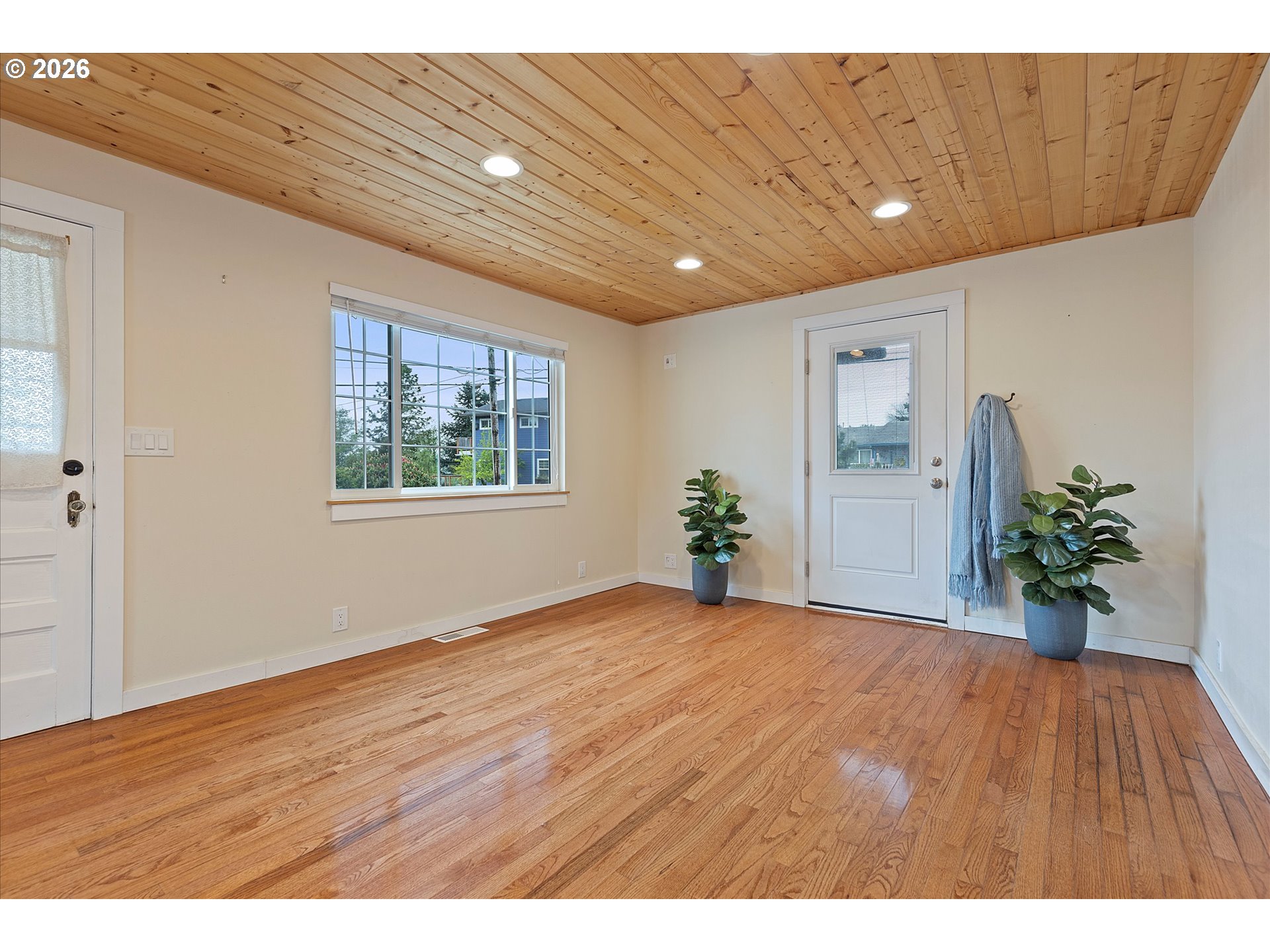 5093 Northeast 49th Street Neotsu, OR 97364 - Photo 8 of 36 a view of an empty room with potted plant and a window