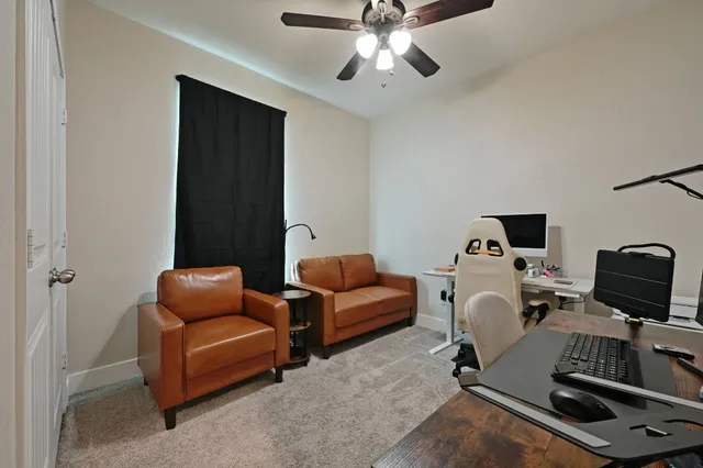 a bedroom with furniture and a window