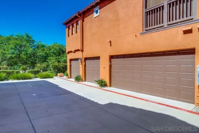 a pathway of a house with a yard