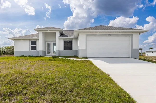 a front view of a house with yard