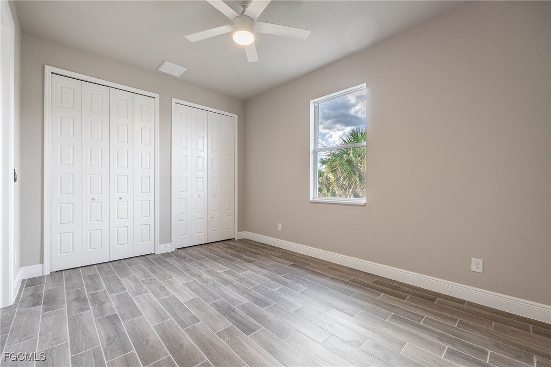 1346 Radio Loop LaBelle, FL 33935 - Photo 18 of 27 a view of an empty room with wooden floor and a window