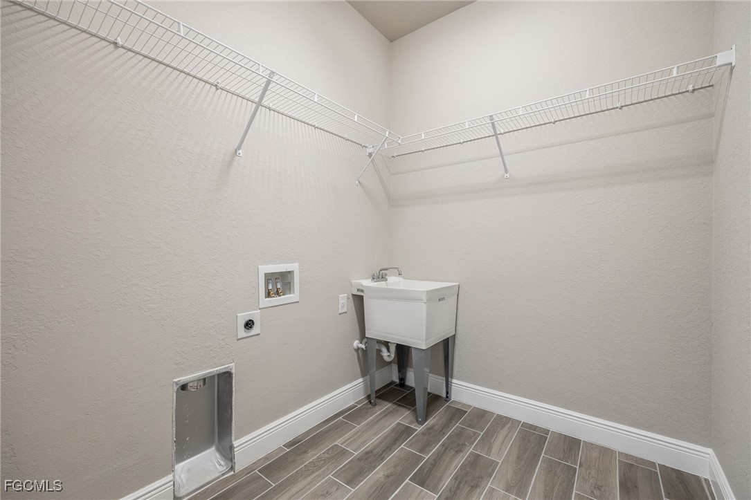 1346 Radio Loop LaBelle, FL 33935 - Photo 26 of 27 a view of a room with racks on the wall