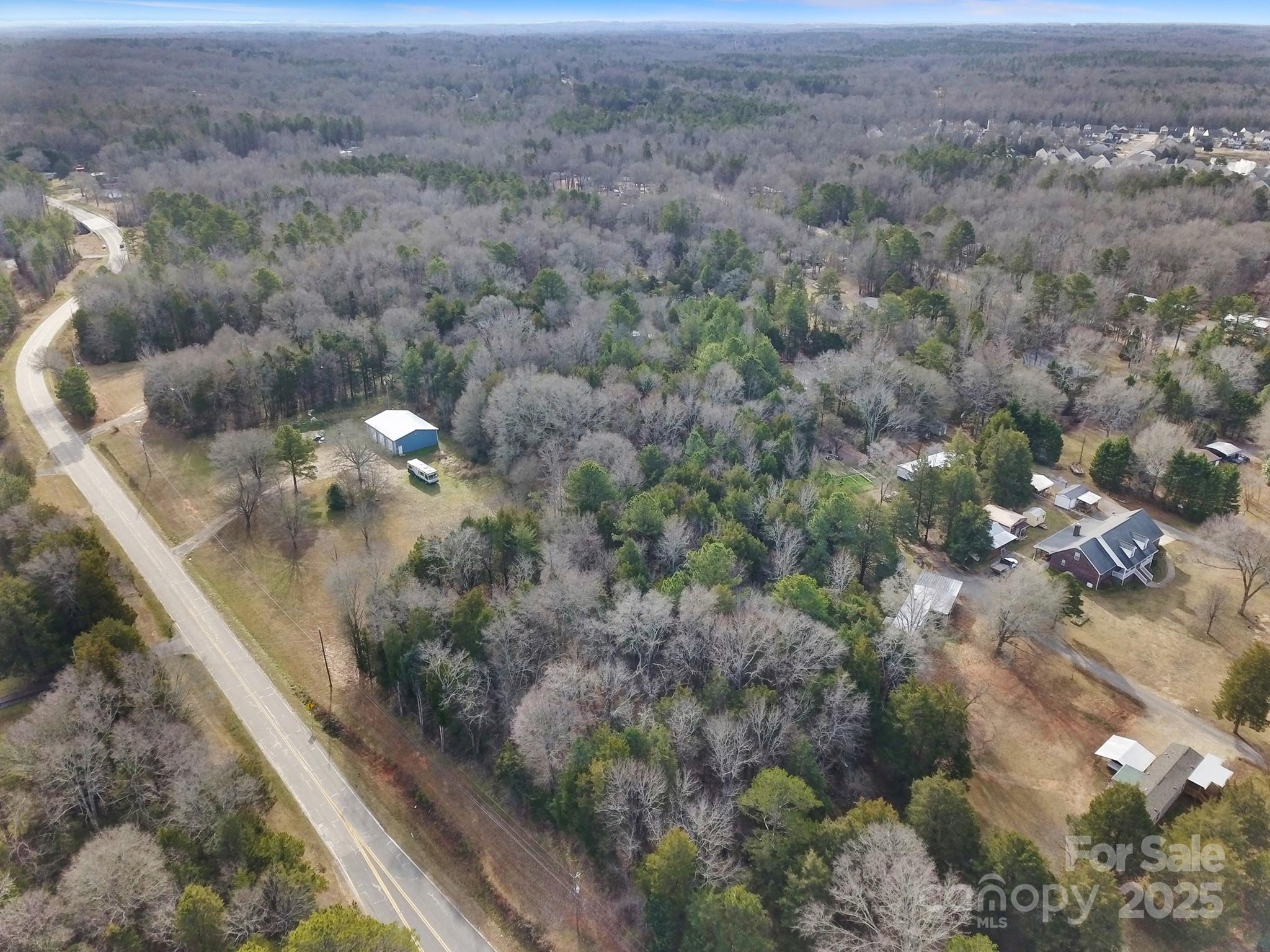 a view of a forest from a balcony