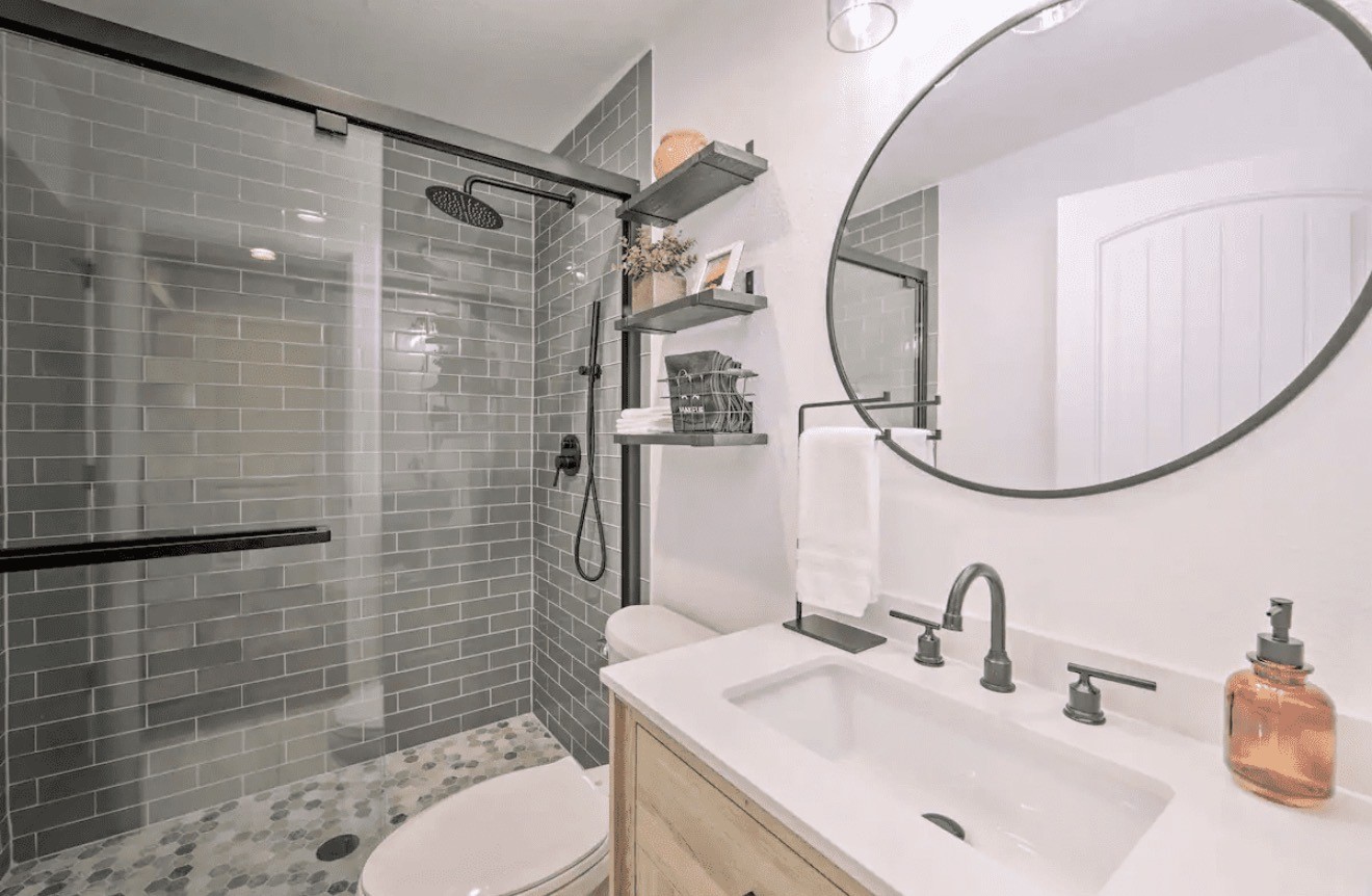 10630 River Ranch Road Kemp, TX 75143 - Photo 22 of 36 a bathroom with a sink mirror toilet and shower