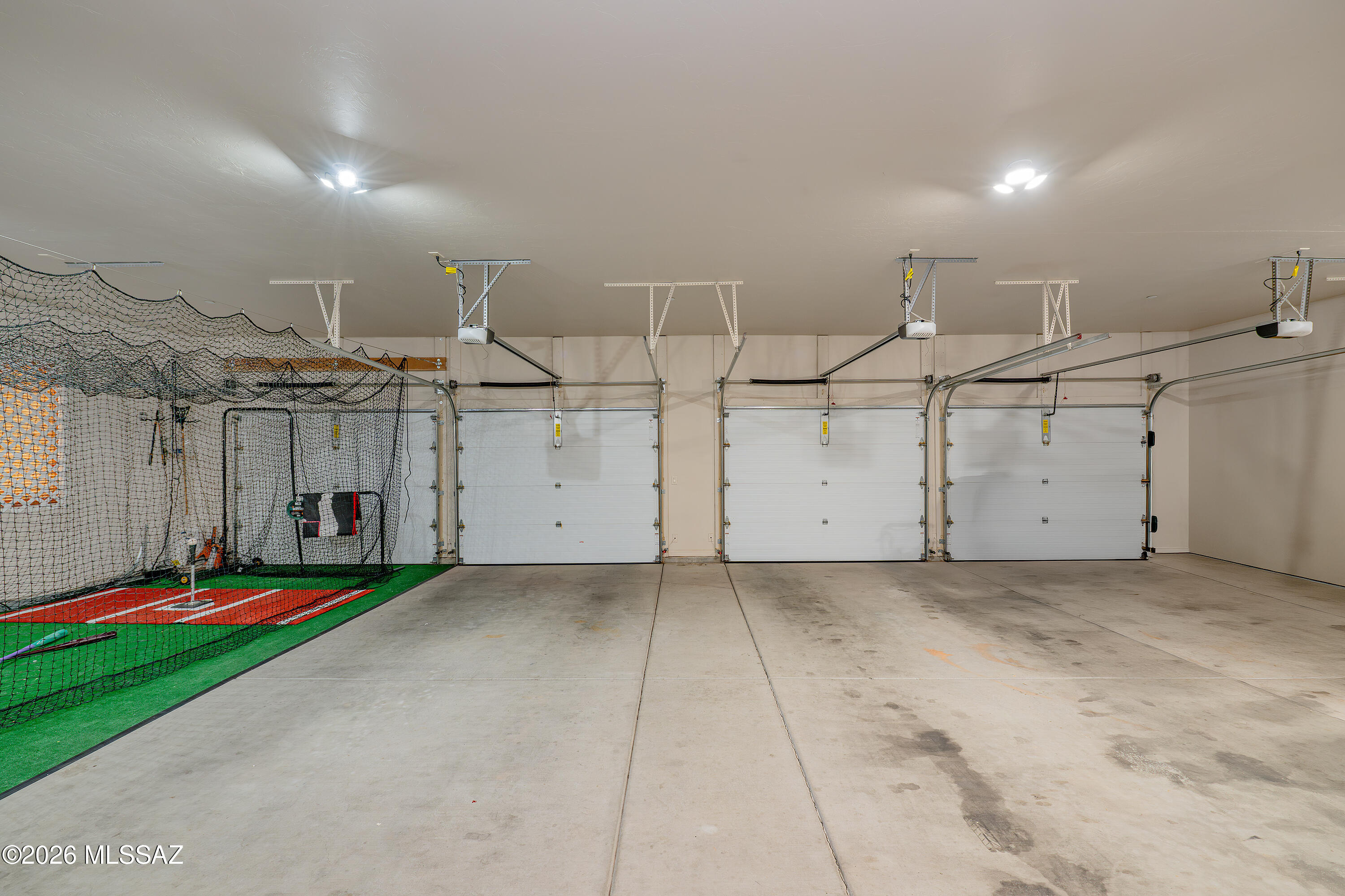 8550 South Picacho View Loop Vail, AZ 85641 - Photo 31 of 51 8-car tandem garage provides plenty of space for your vehicles, storage, and other activities. 1 bay currently serving as an indoor batting cage!