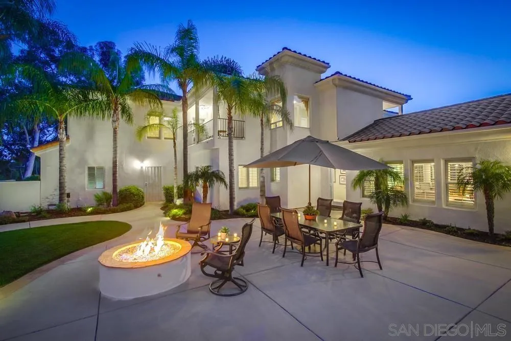 14399 Blue Sage Road Poway, CA 92064 - Photo 15 of 70 a view of a patio with table and chairs under an umbrella