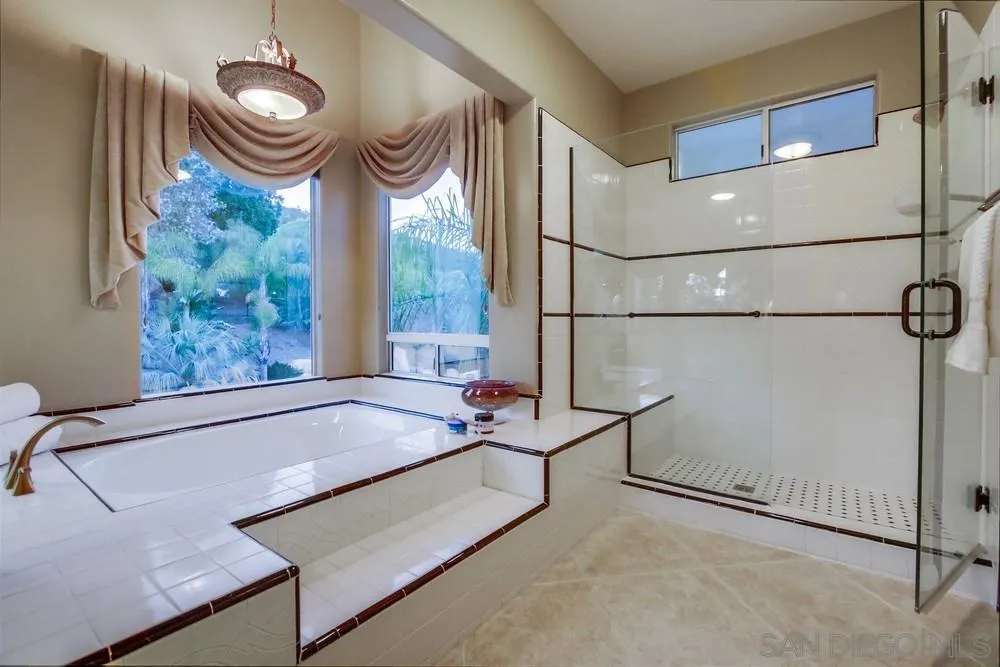 14399 Blue Sage Road Poway, CA 92064 - Photo 36 of 70 a bathroom with a tub and a window