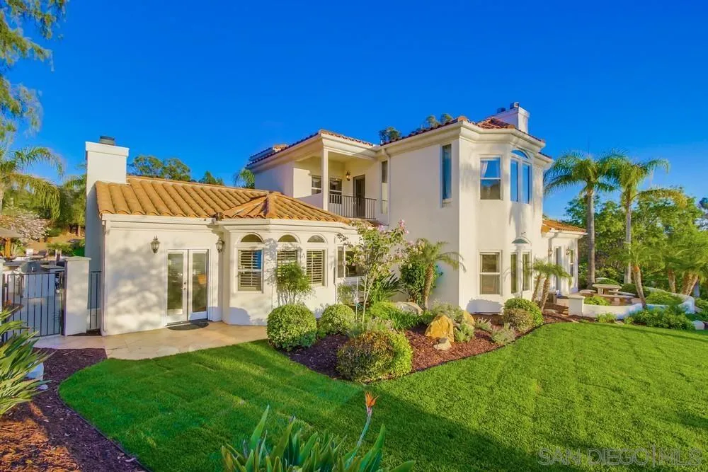 14399 Blue Sage Road Poway, CA 92064 - Photo 52 of 70 a view of a white house with a big yard and potted plants