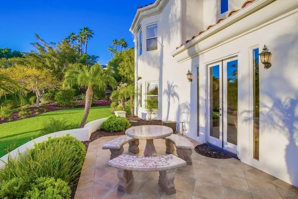 14399 Blue Sage Road Poway, CA 92064 - Photo 54 of 70 a view of a patio with a table chairs and a yard