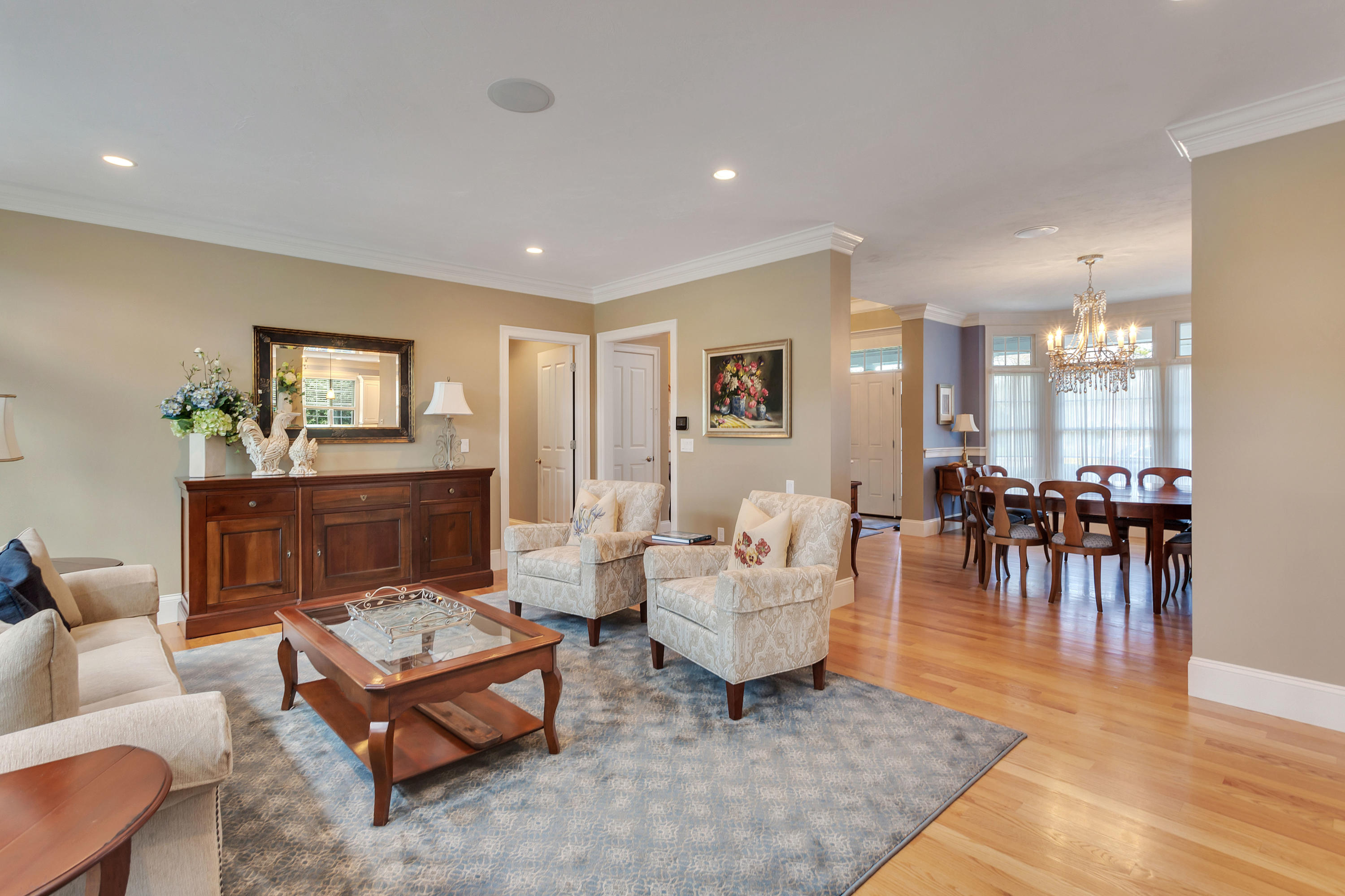 10 Open Space Drive Sandwich, MA 02563 - Photo 12 of 49 a living room with furniture and a dining table with wooden floor