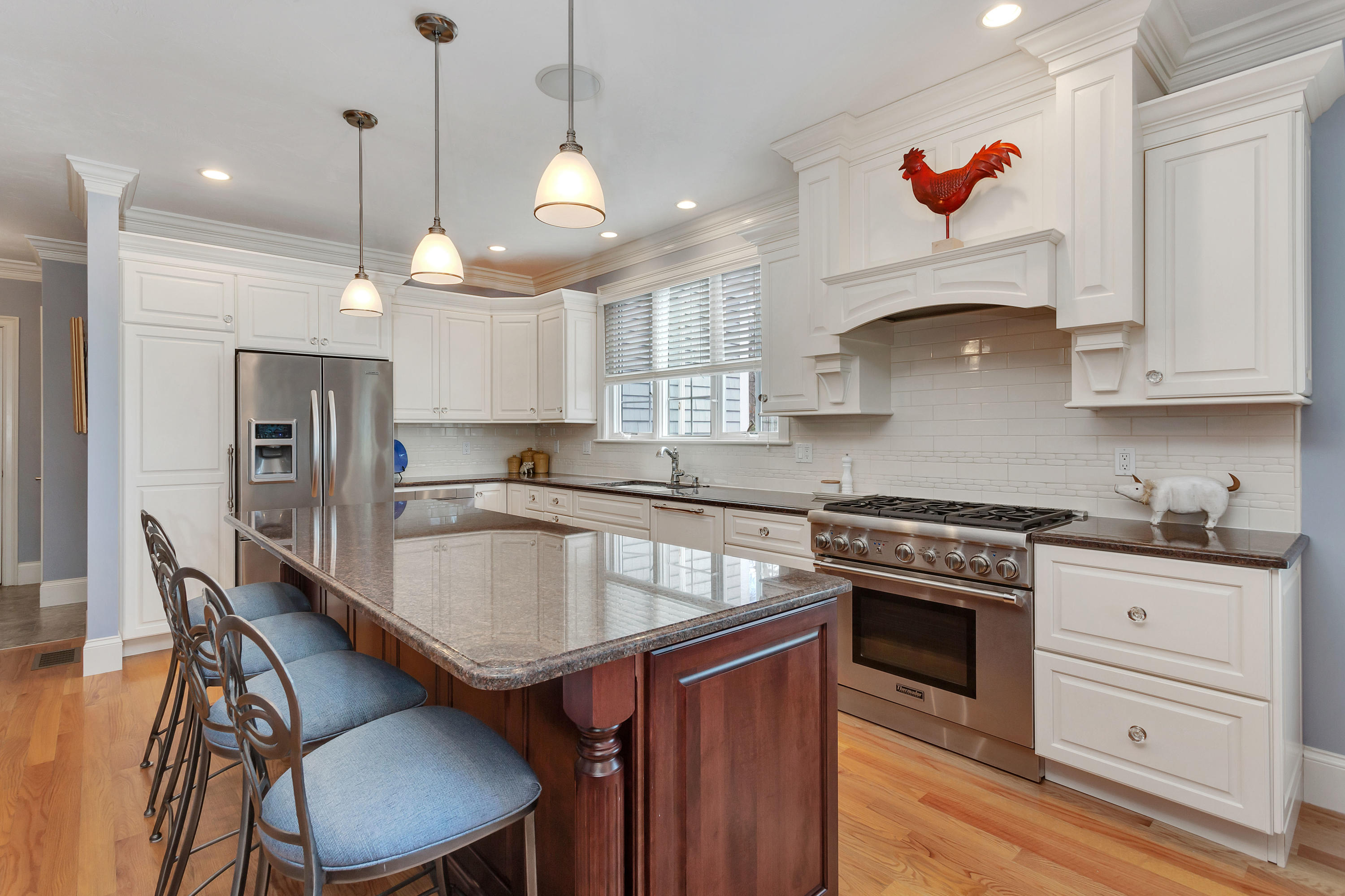 10 Open Space Drive Sandwich, MA 02563 - Photo 14 of 49 a kitchen with granite countertop a stove a sink a refrigerator and chairs
