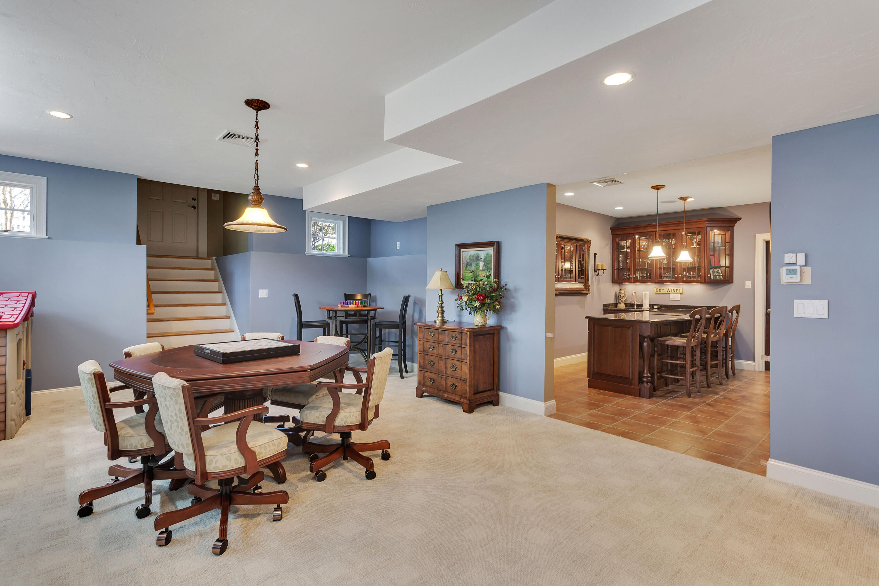 10 Open Space Drive Sandwich, MA 02563 - Photo 37 of 49 a kitchen with stainless steel appliances kitchen island granite countertop a dining table chairs and a refrigerator