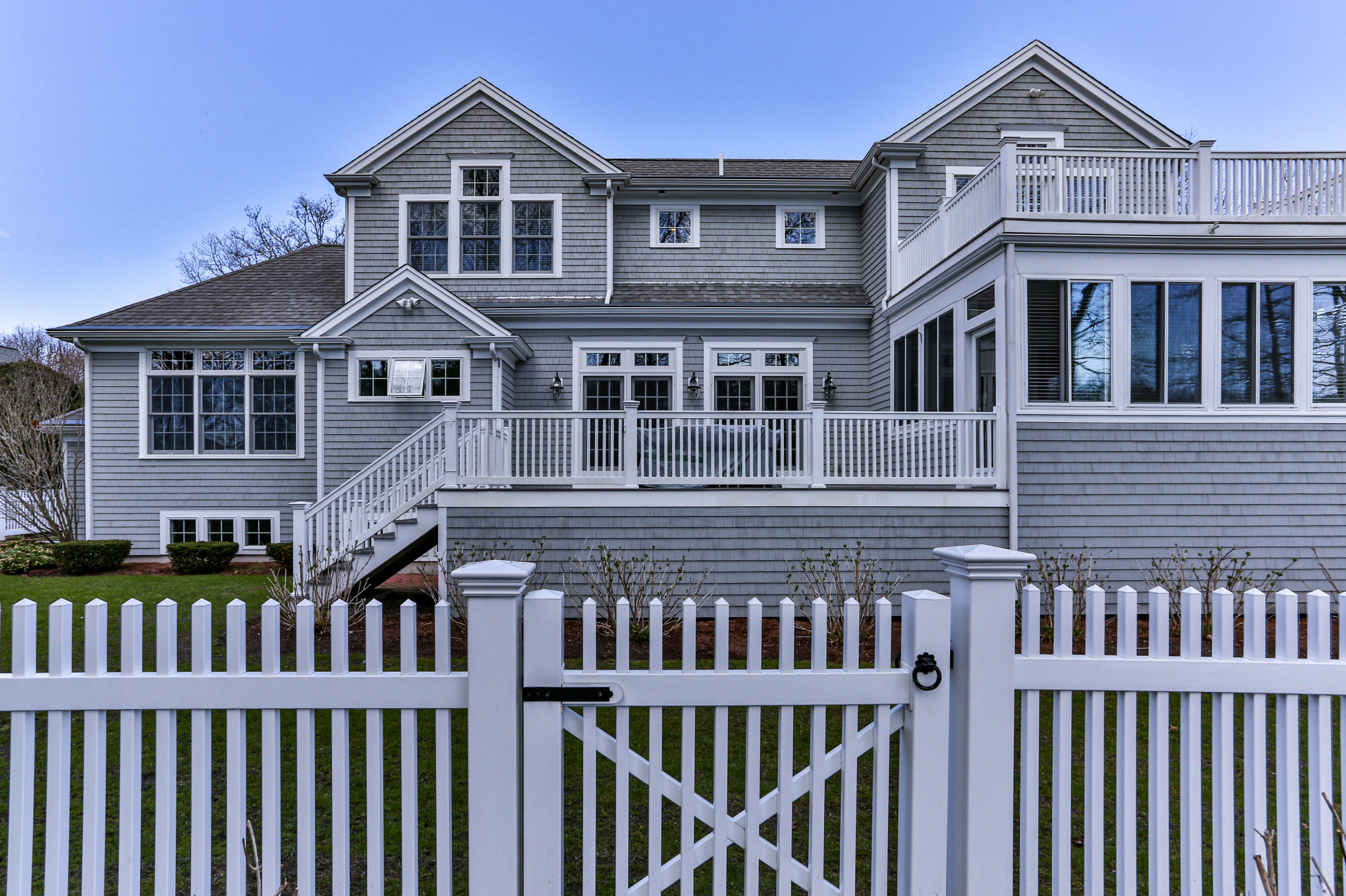 10 Open Space Drive Sandwich, MA 02563 - Photo 45 of 49 a view of a brick house with large windows