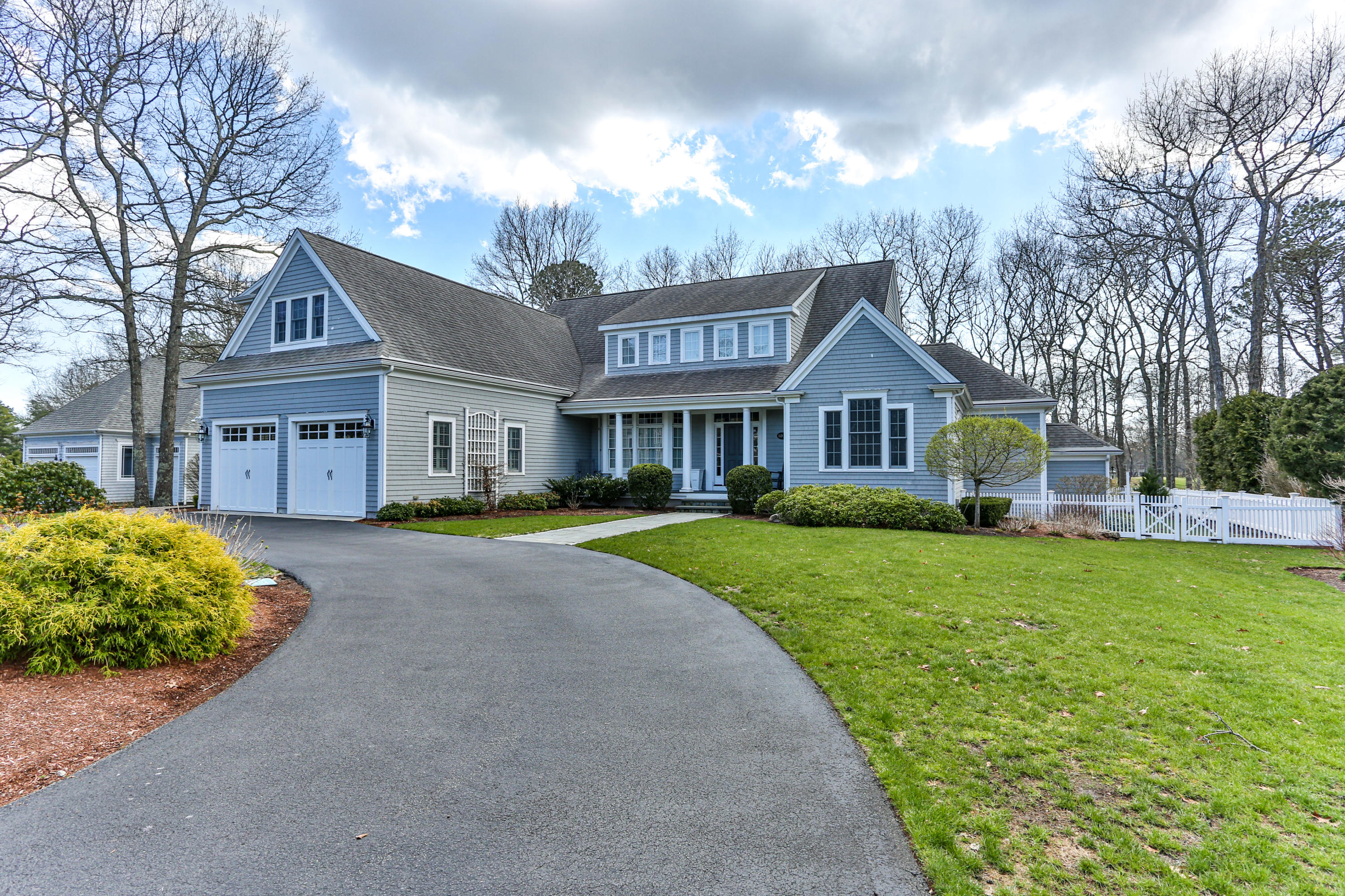 10 Open Space Drive Sandwich, MA 02563 - Photo 6 of 49 a front view of a house with a yard and garage