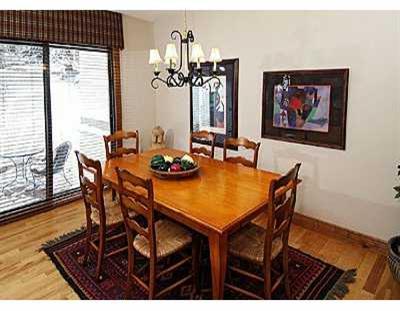 2350 Bald Mountain Road, Unit 3 Vail, CO 81657 - Photo 3 of 8 a view of a dining room with furniture and wooden floor