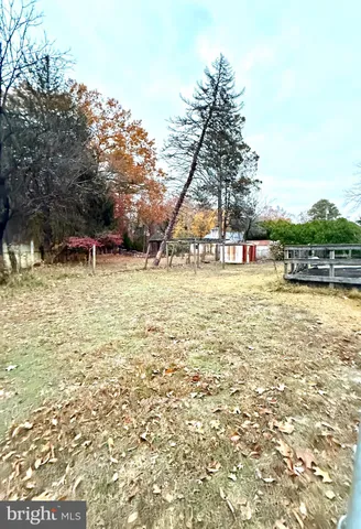 a swimming pool with outdoor seating and yard