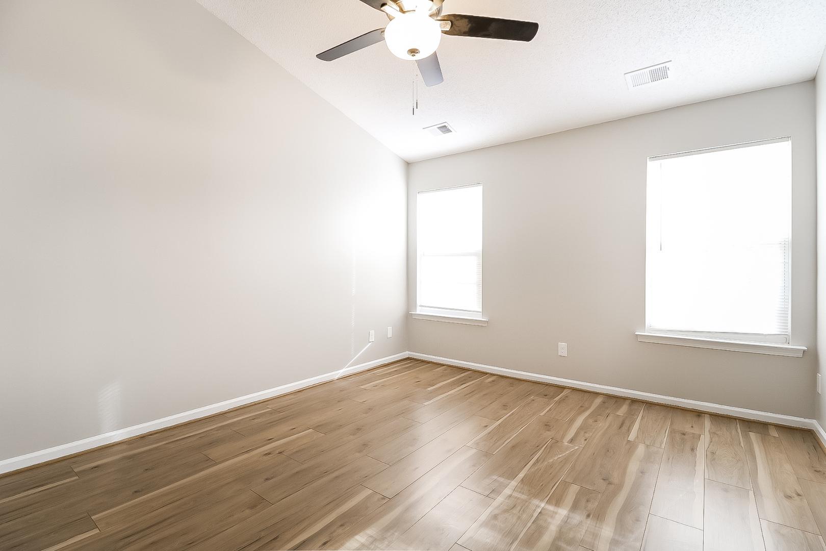 5900 Wessel Way Raleigh, NC 27610 - Photo 11 of 17 an empty room with a window and a fan
