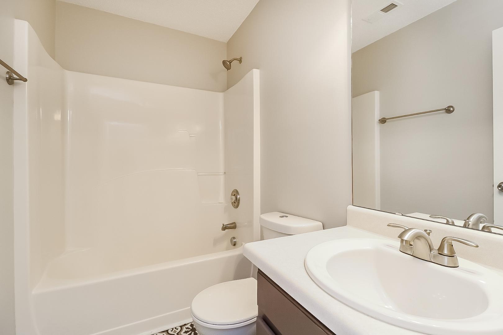 5900 Wessel Way Raleigh, NC 27610 - Photo 15 of 17 a bathroom with a toilet a sink and a bathtub