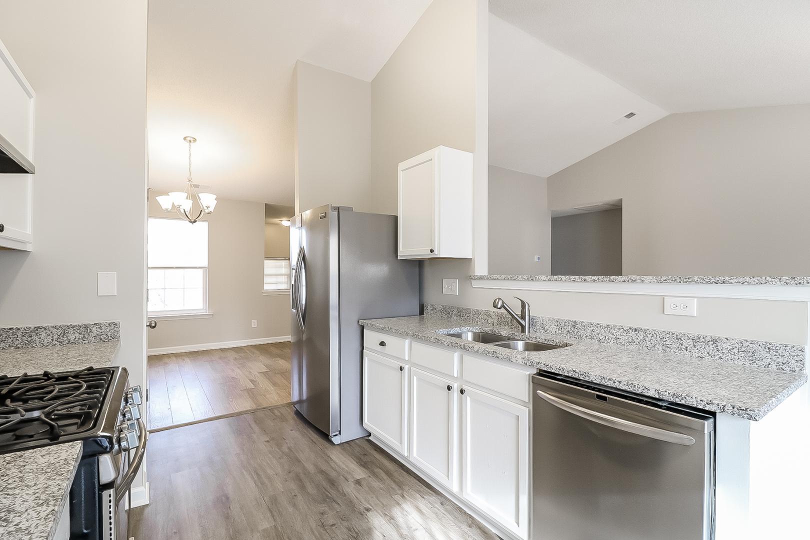 5900 Wessel Way Raleigh, NC 27610 - Photo 8 of 17 a kitchen with a sink stove and refrigerator