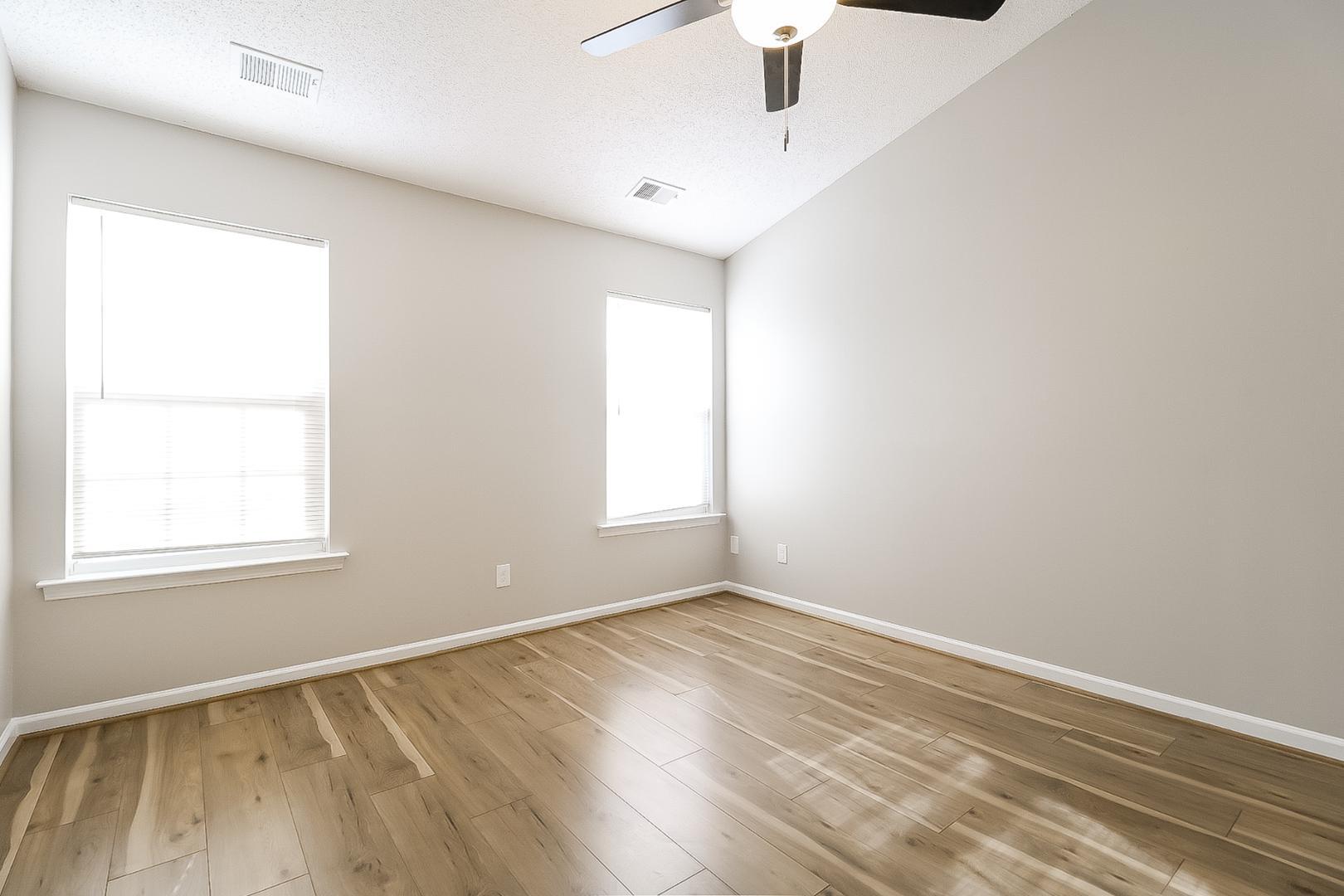 5900 Wessel Way Raleigh, NC 27610 - Photo 9 of 17 an empty room with a window and wooden floor