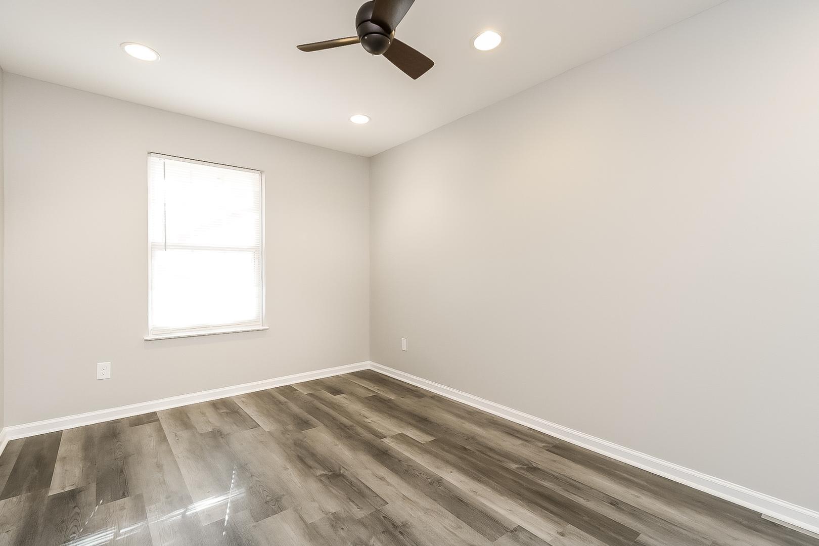 5900 Wessel Way Raleigh, NC 27610 - Photo 10 of 17 an empty room with a window and a ceiling fan