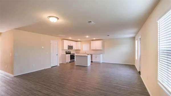 a view of kitchen with wooden floor