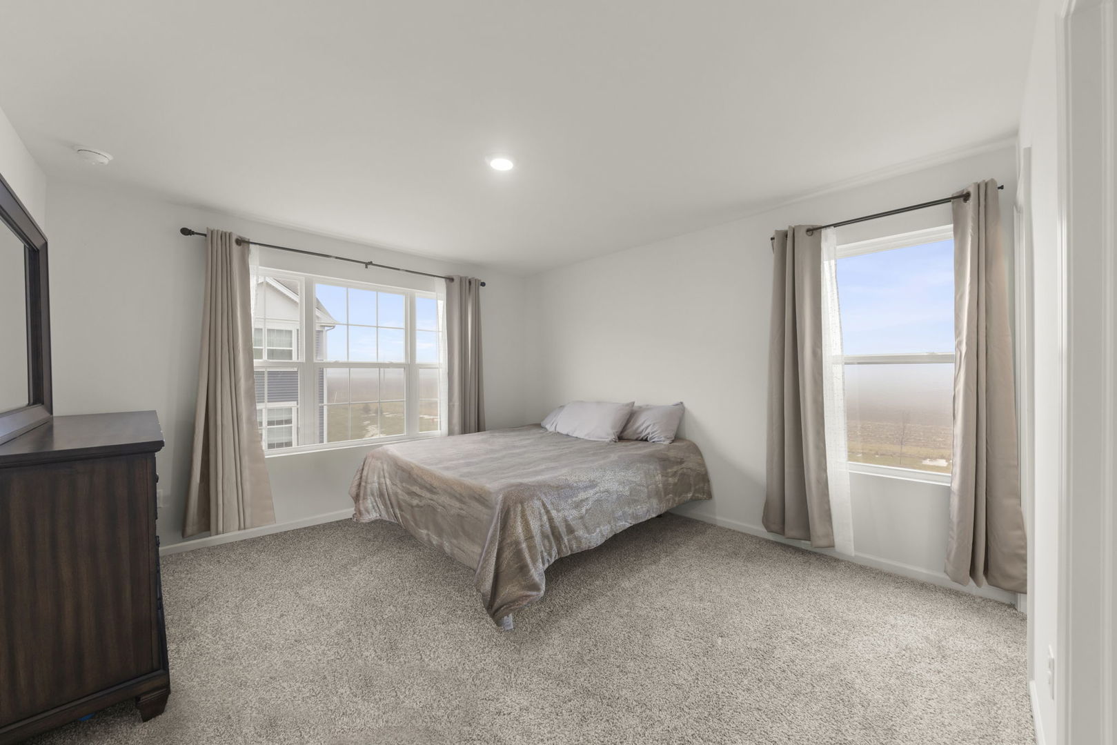 1561 Sequoia Way Pingree Grove, IL 60140 - Photo 12 of 25 a spacious bedroom with a bed and a window