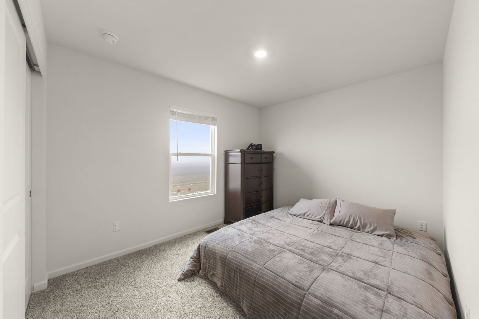 1561 Sequoia Way Pingree Grove, IL 60140 - Photo 15 of 25 a bedroom with a bed and window