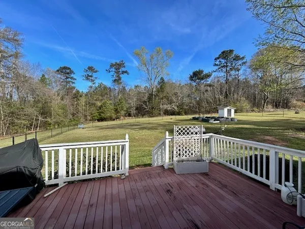 a view of a deck with sunset view