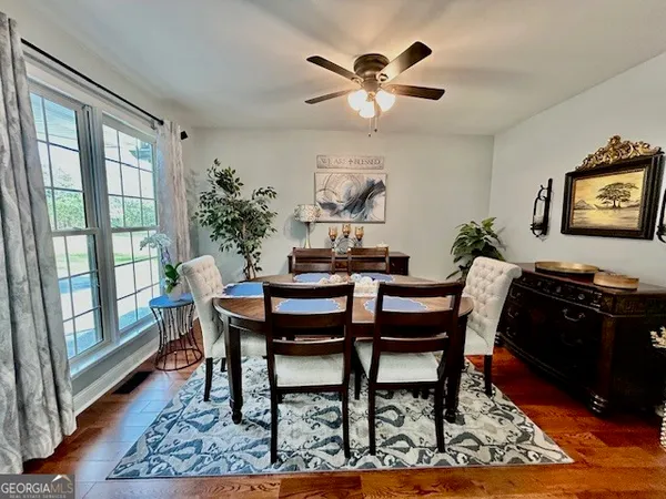 a view of a dining room with furniture