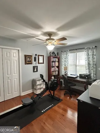 a living room with furniture window and wooden floor