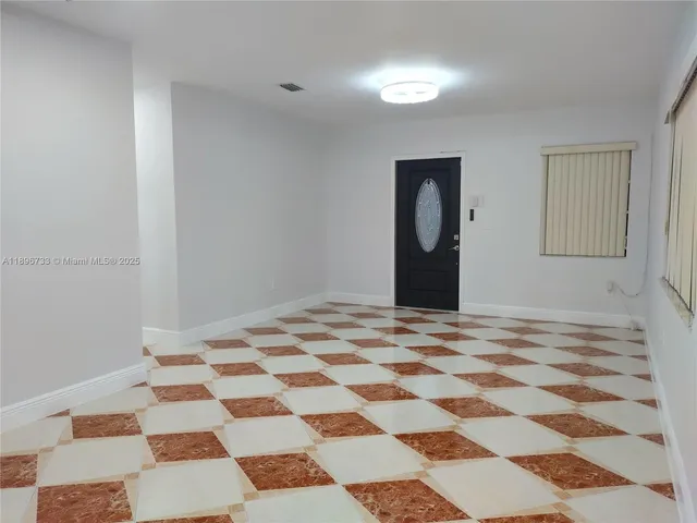 a bedroom with a bed and a cabinets