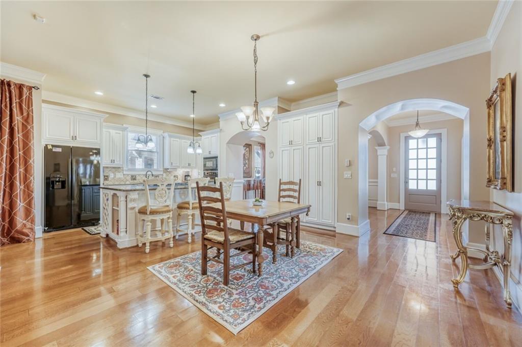 2380 Muskogee Lane Braselton, GA 30517 - Photo 15 of 30 a view of a dining room and livingroom with furniture wooden floor a chandelier