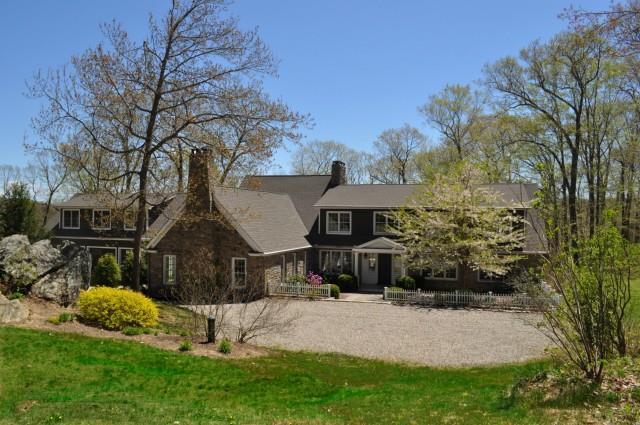 43 Horse Heaven Road Washington, CT 06793 - Photo 1 of 1 a front view of a house with garden