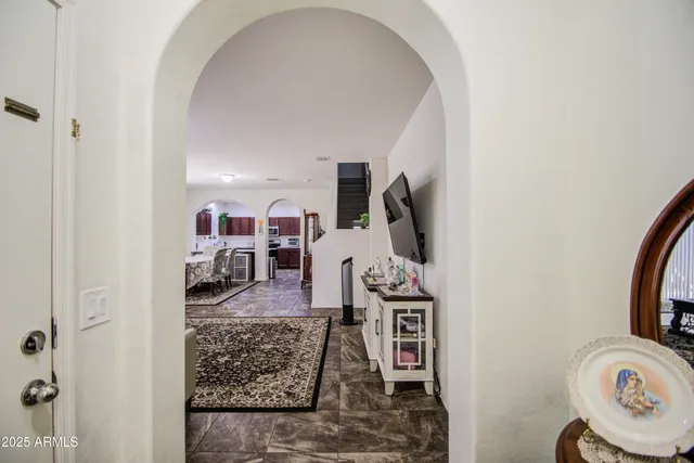 a view of living room with furniture and a wooden floor