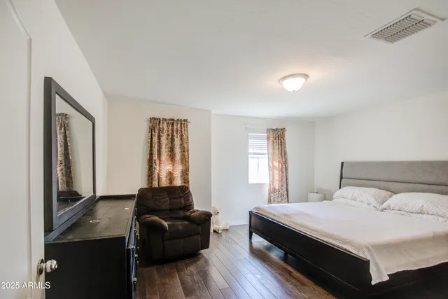 a bedroom with a bed and window