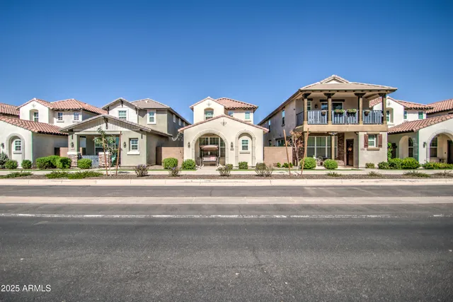 a view of multiple houses with a street