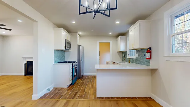 a kitchen with cabinets and stainless steel appliances