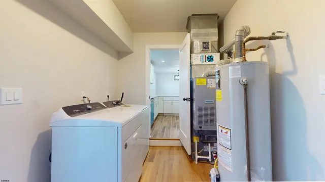 a view of a big room with wooden floor and windows